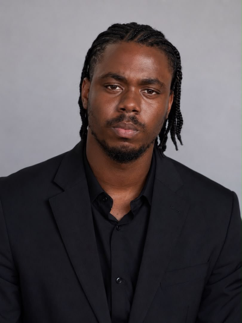 Daniel Lordson wearing a black suit